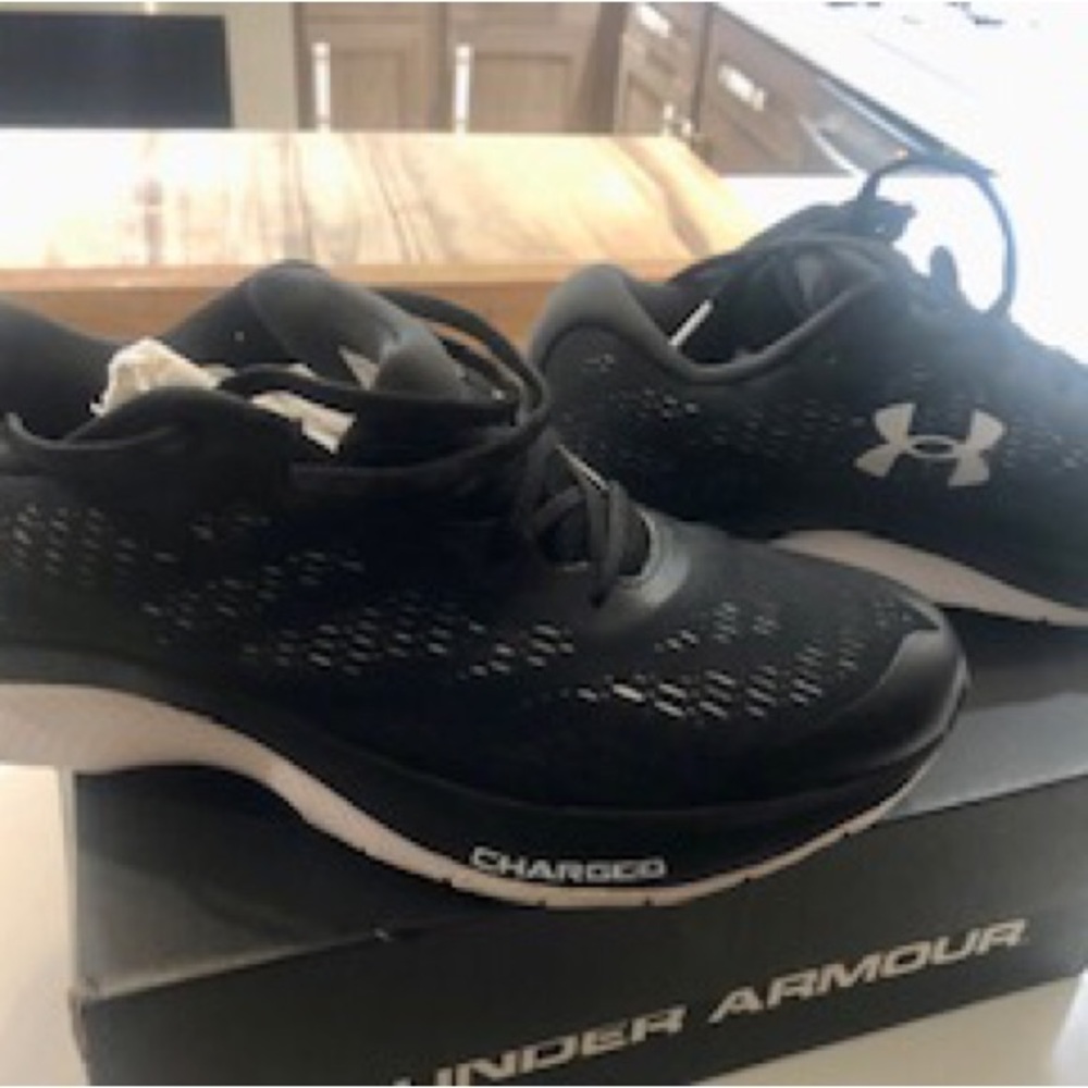 Like new Under Armour charged S Bandit black sneakers worn 1;time inside.8 1/2